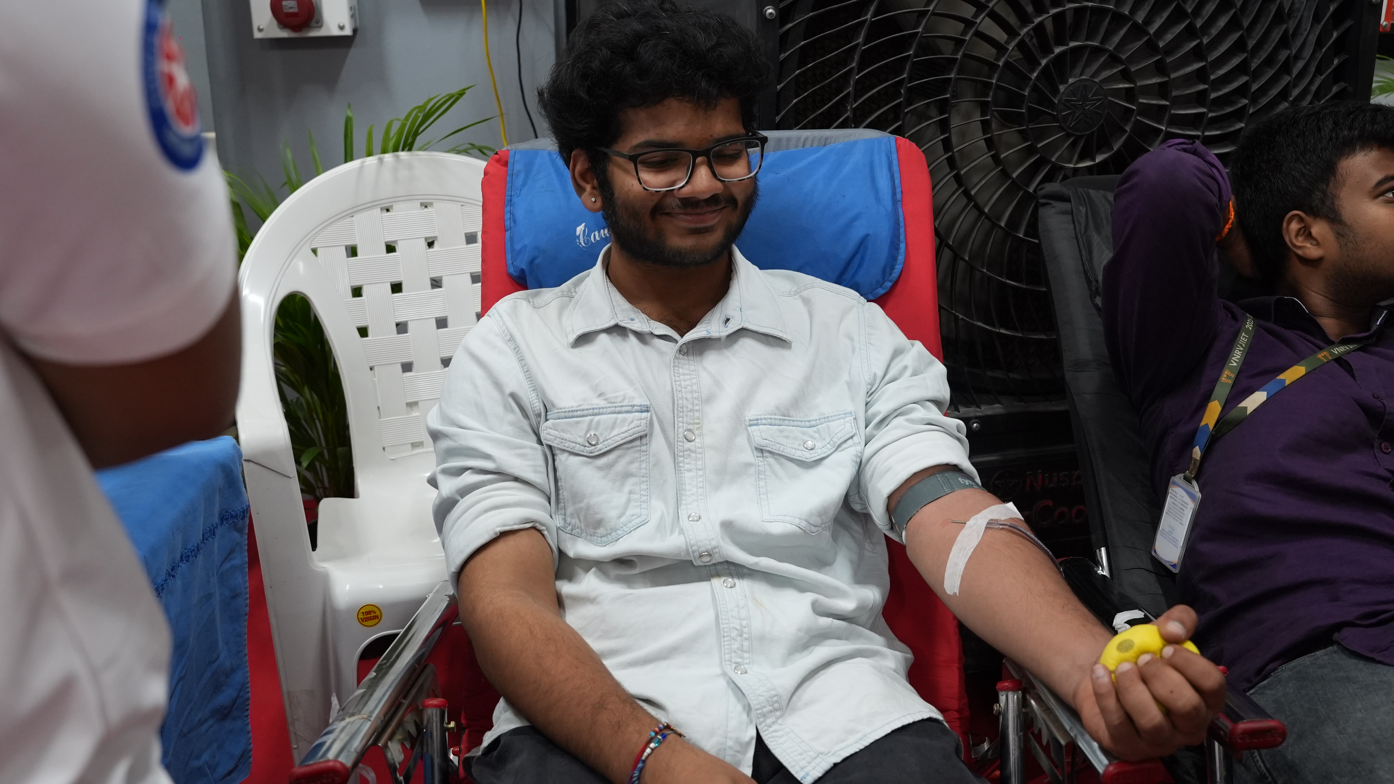 A participant donating blood during the VNRVJIET drive